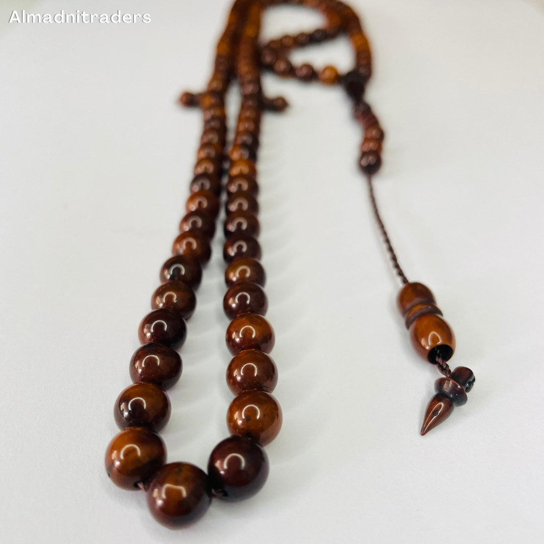 "Kokka Wood Tasbeeh - Close-up of natural wood beads"