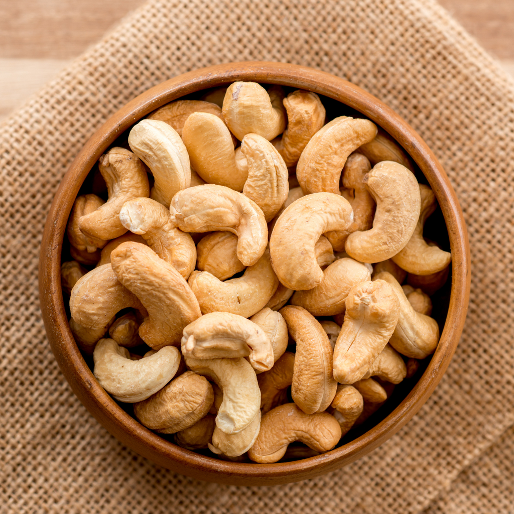 A bowl of fresh, creamy cashews ready for snacking or cooking.
