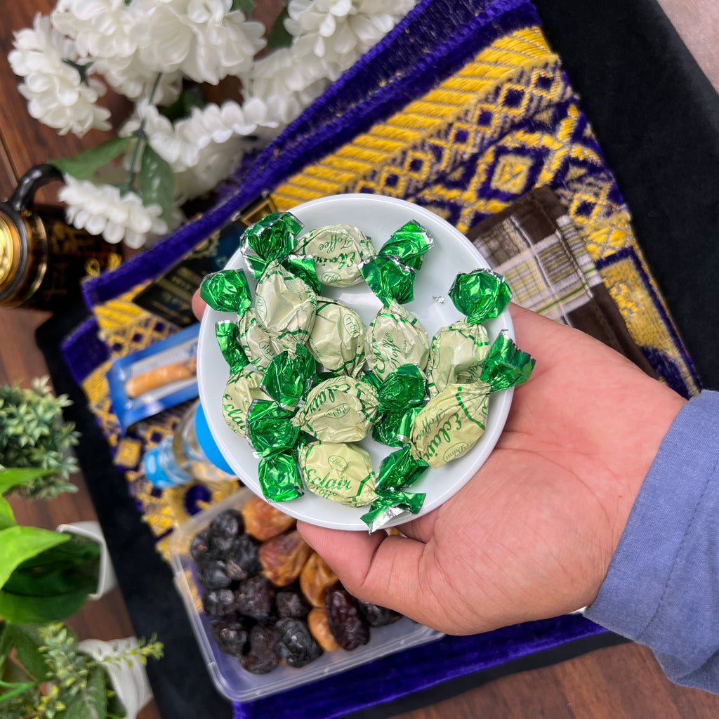 Hajj Saughat featuring a traditional Namaz Cap and chocolates