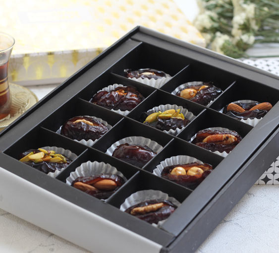 Qalmi date with Almond in its premium packaging.