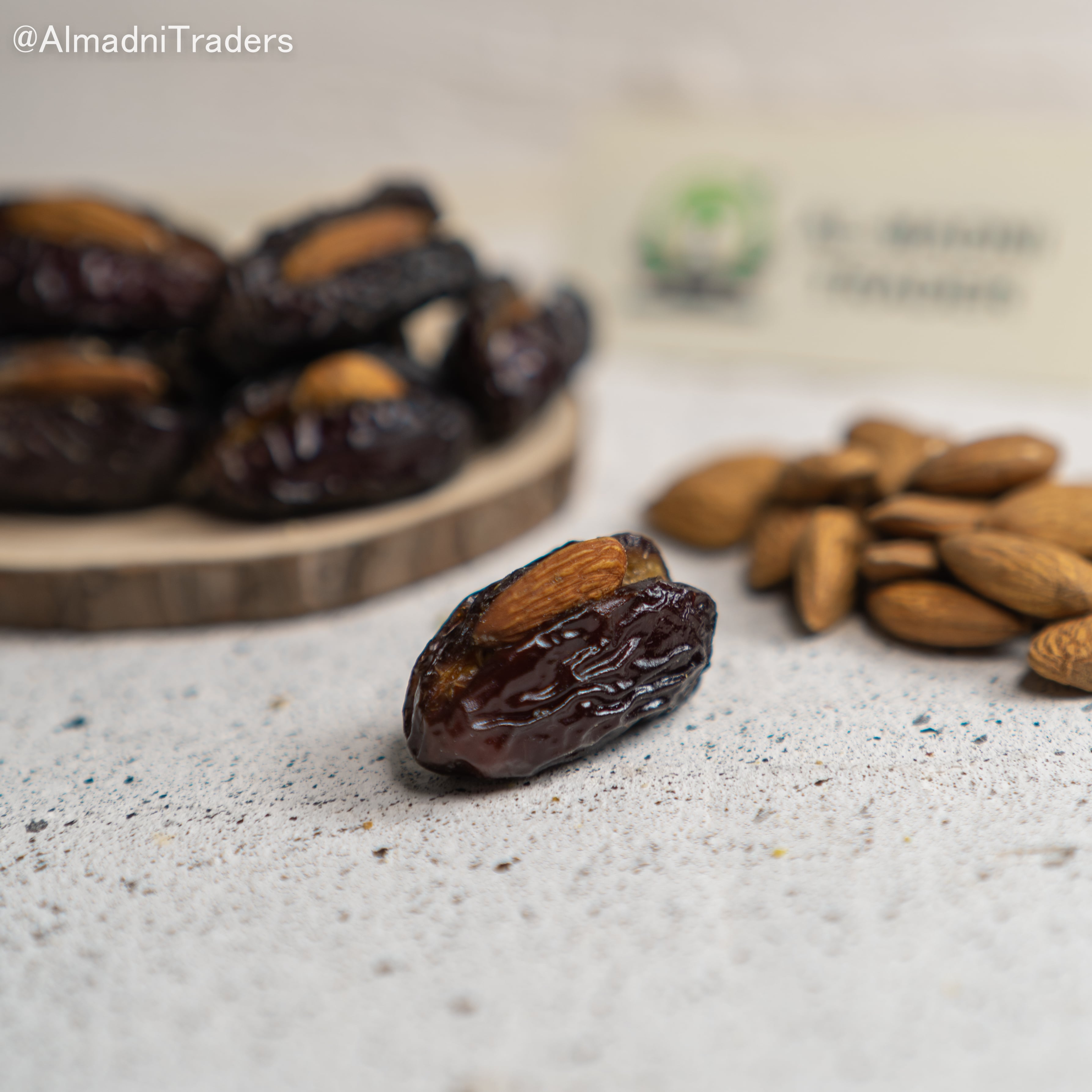 Qalmi khajoor with Almond showing its freshness & texture.