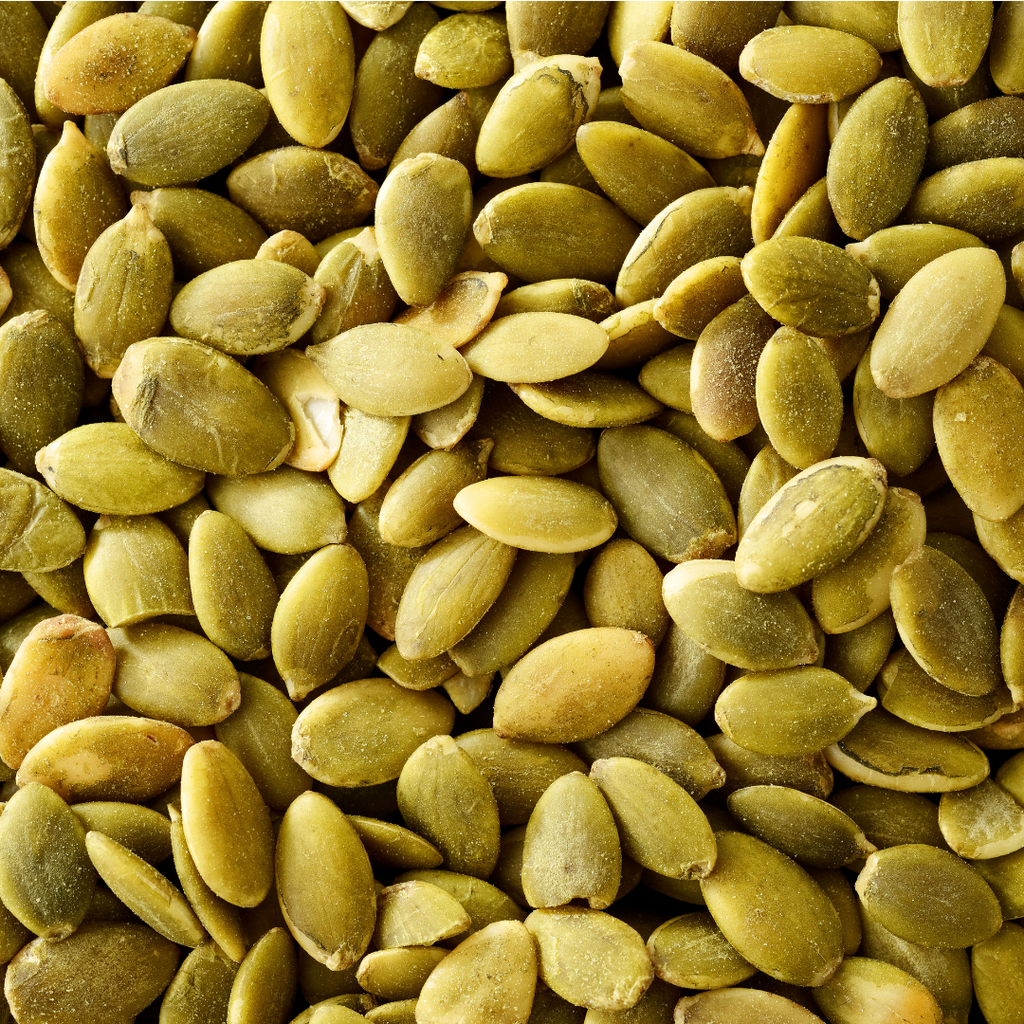 Close-up of shelled pumpkin seeds showcasing their natural texture.